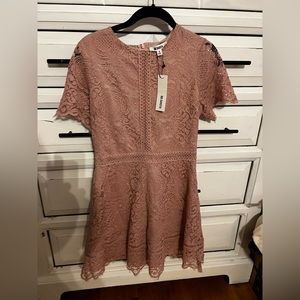 Brand new with tags.  Bought for a wedding but was too big for me.